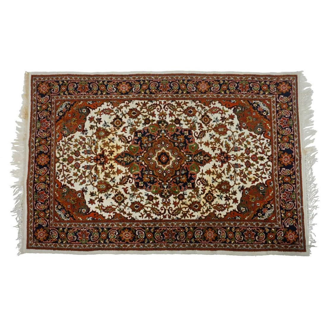 Persian Rug: Semi Antique Persian Wool Rug. Floral designed with center medallion on multi color ground. Measures 71" x 49-1/2". Condition: Some stains, losses to fringes, needs cleaning. Estimate: $100.00 - $300.