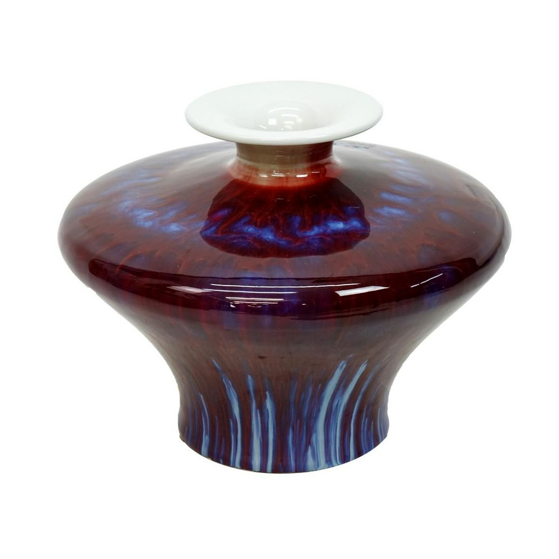 20th C. Chinese Sang de Beouf Vase: 20th Century Chinese Sang de Beouf Flambe Porcelain Vase. Unsigned. Measures 9-1/4" x 11-3/4". Condition: Typical crazing or else good condition. Estimate: $150.00 - $300.00 Domestic Shipping: $88.00
