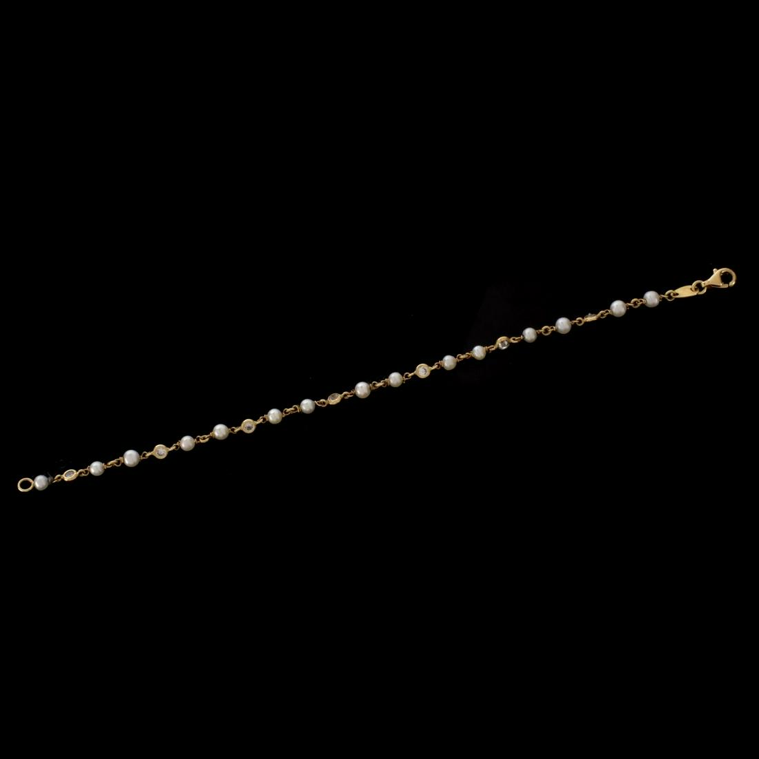 Diamond, Pearl and 14K Bracelet: Vintage Approx. 1.0 Carat TW Seven Round Brilliant Cut Diamond, 3.5mm Pearl and 14 Karat Yellow Gold Bracelet. Diamonds G-H color, VS1-VS2 clarity. Stamped 585 to clasp. Measures 7-1/8" L. Approx. wei