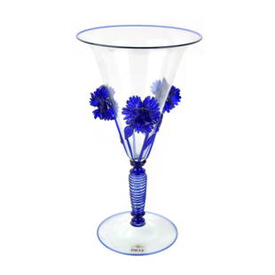 Pauly & Co. Murano Glass Goblet: Vintage Pauly & Co. Murano Blue and Clear Glass Goblet with Deep Relief Flower Design. Maker's label to base. Measures 9-3/4" H, 5-1/4" W (at rim). Condition: Very good vintage condition. Estimate: $5