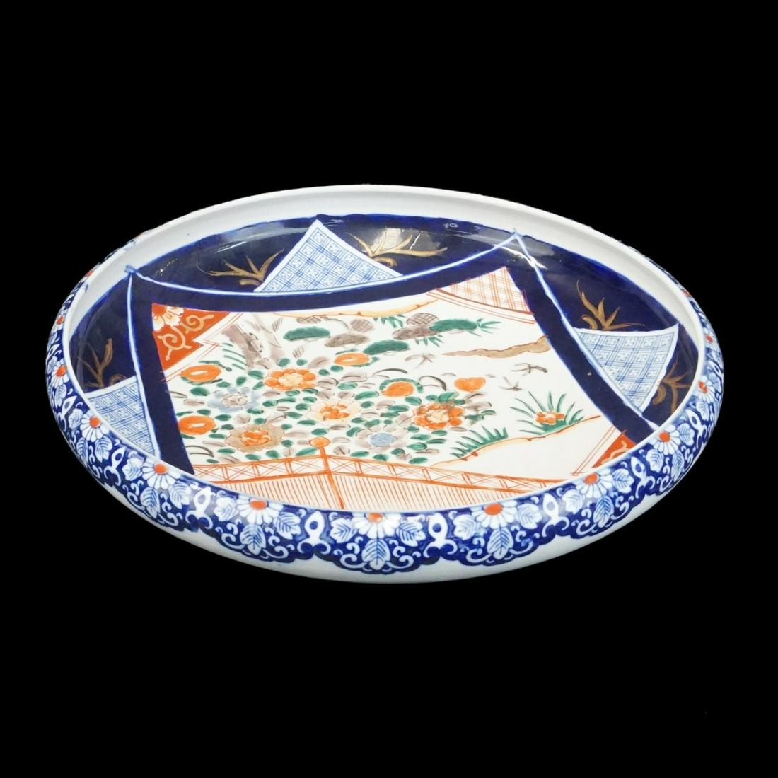 Japanese Shallow Bowl: Antique Japanese Imari Porcelain Shallow Bowl. Signed. Measures 3" x 13". Condition: Good condition. Estimate: $100.00 - $300.00 Domestic Shipping: $95.00