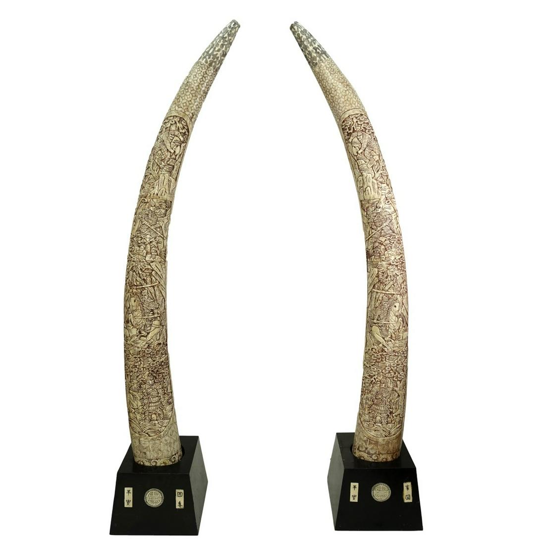 Pair of Palace Size Chinese "Tusks": Pair of Palace Size Chinese Polychrome Bone Veneered "Tusks" in Fitted Wooden Base. Each with mirrored images of warriors with swords drawn and on horseback. Each are also signed at the base. Spencer 