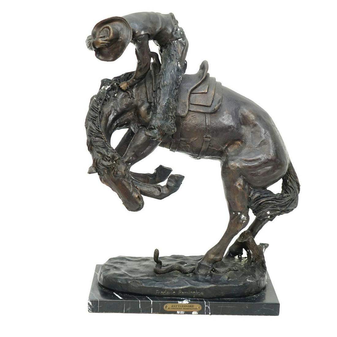 After: Frederic Remington, American (1861 - 1909): After: Frederic Remington, American (1861 - 1909) Bronze Sculpture on Marble Base "Rattlesnake" Signed. Tag attached to base. Overall measures 23" x 17". Condition: Some white spotting otherwise good 