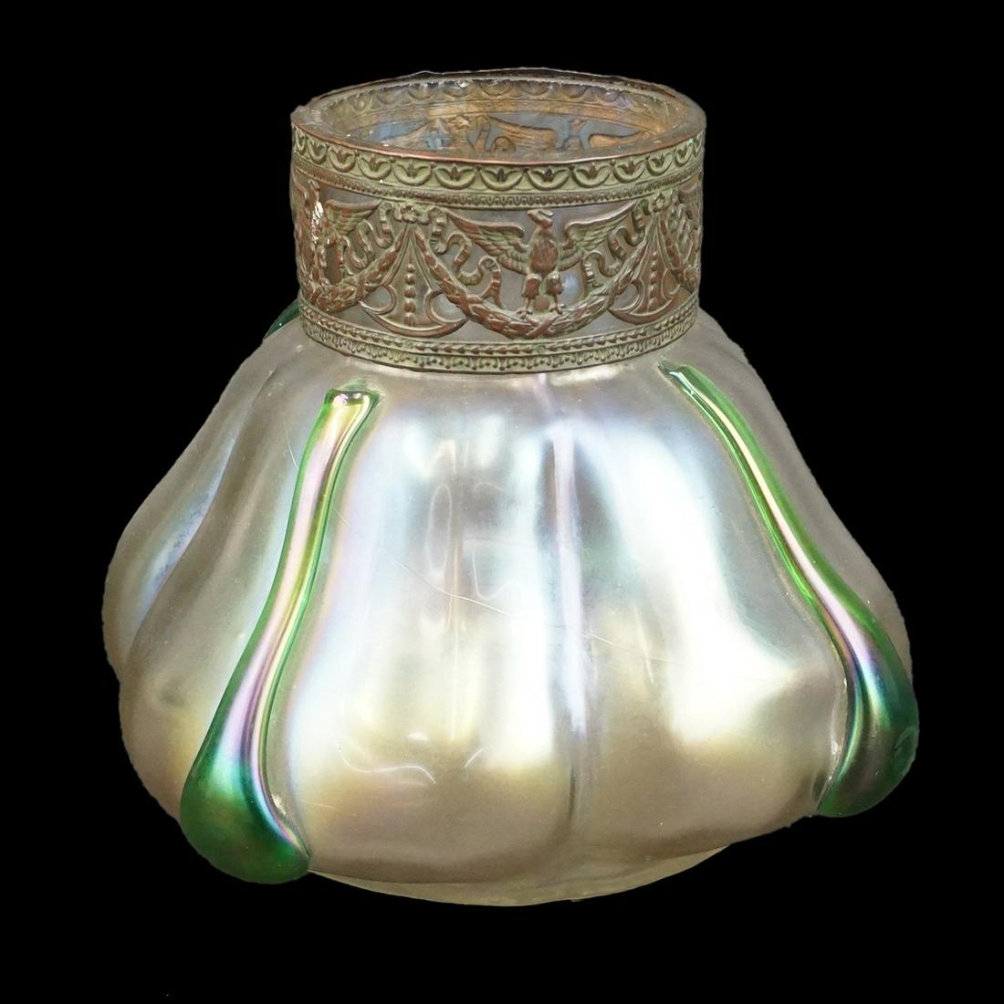Mnnr of Loetz Vase: In The Manner of Loetz Iridescent Glass Vase with Bronzed Metal Collar. Unmarked. Measures 6" x 6-1/4". Condition: Good condition. Estimate: $100.00 - $150.00 Domestic Shipping: $66.00