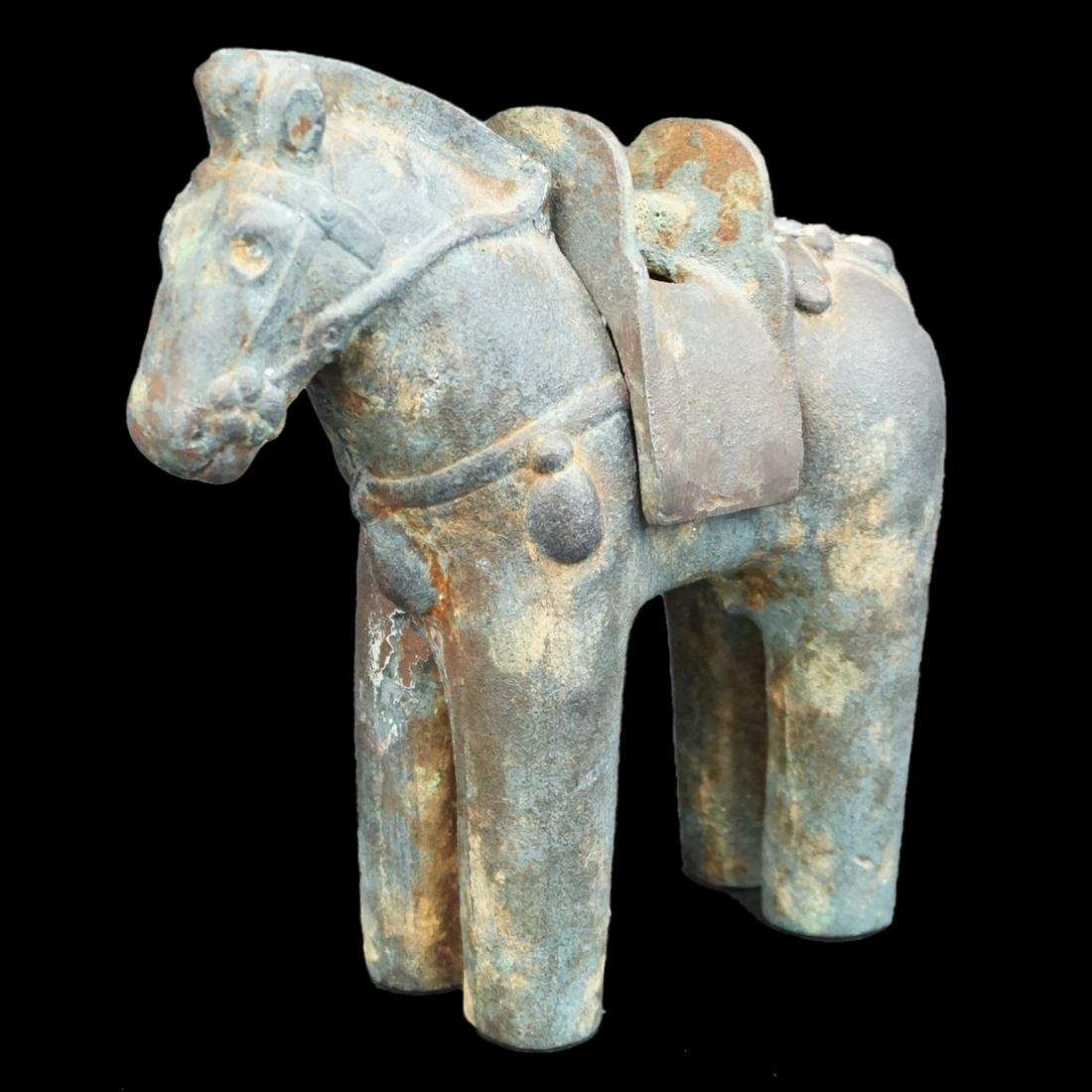 Antique Chinese Iron Horse Sculpture: Chinese Iron Horse Sculpture with removable saddle and hollow body. Dark Patina. Measures 7" H x 6-1/2" W x 2-1/4" D. Condition: Good Condition some rusting to Patina. Estimate: $50.00 - $150.00 Domes