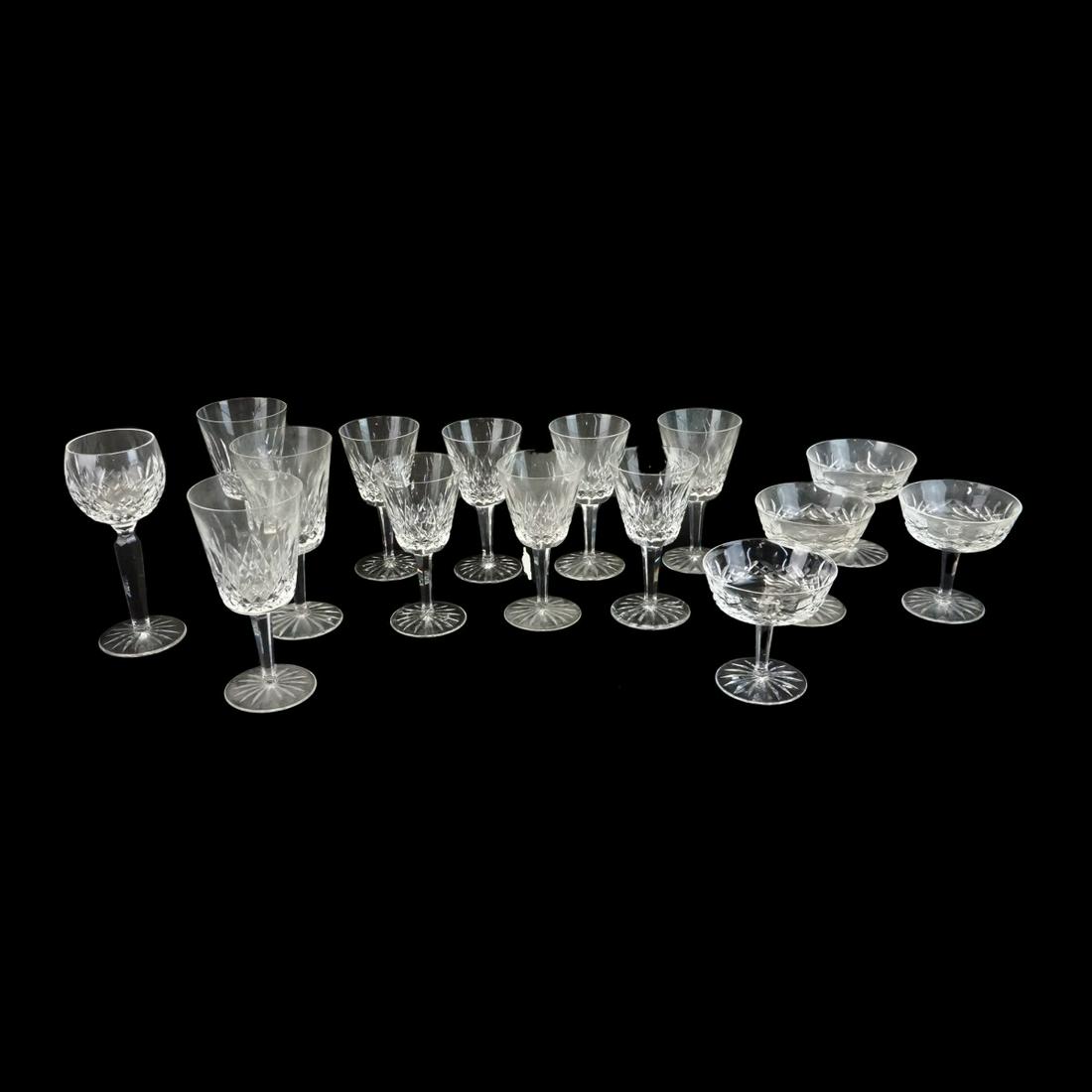 Waterford Stemware: Lot of Fifteen (15) Waterford "Lismore" Crystal Stemware. Includes: (3) water goblets measuring 7" x 3-1/2", (7) claret wines measuring 5-7/8" x 3", (4) champagnes / tall sherbets, and a hock wine. Si