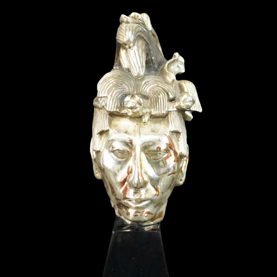 D'Argenta Mayan Head: Large D'Argenta Silver-Clad Bust of a Mayan Head Presented on a Plinth Base. Unsigned. Overall measures 22-1/4" x 7" x 8". Condition: Needs a routine cleaning otherwise good condition. Estimate: $200.