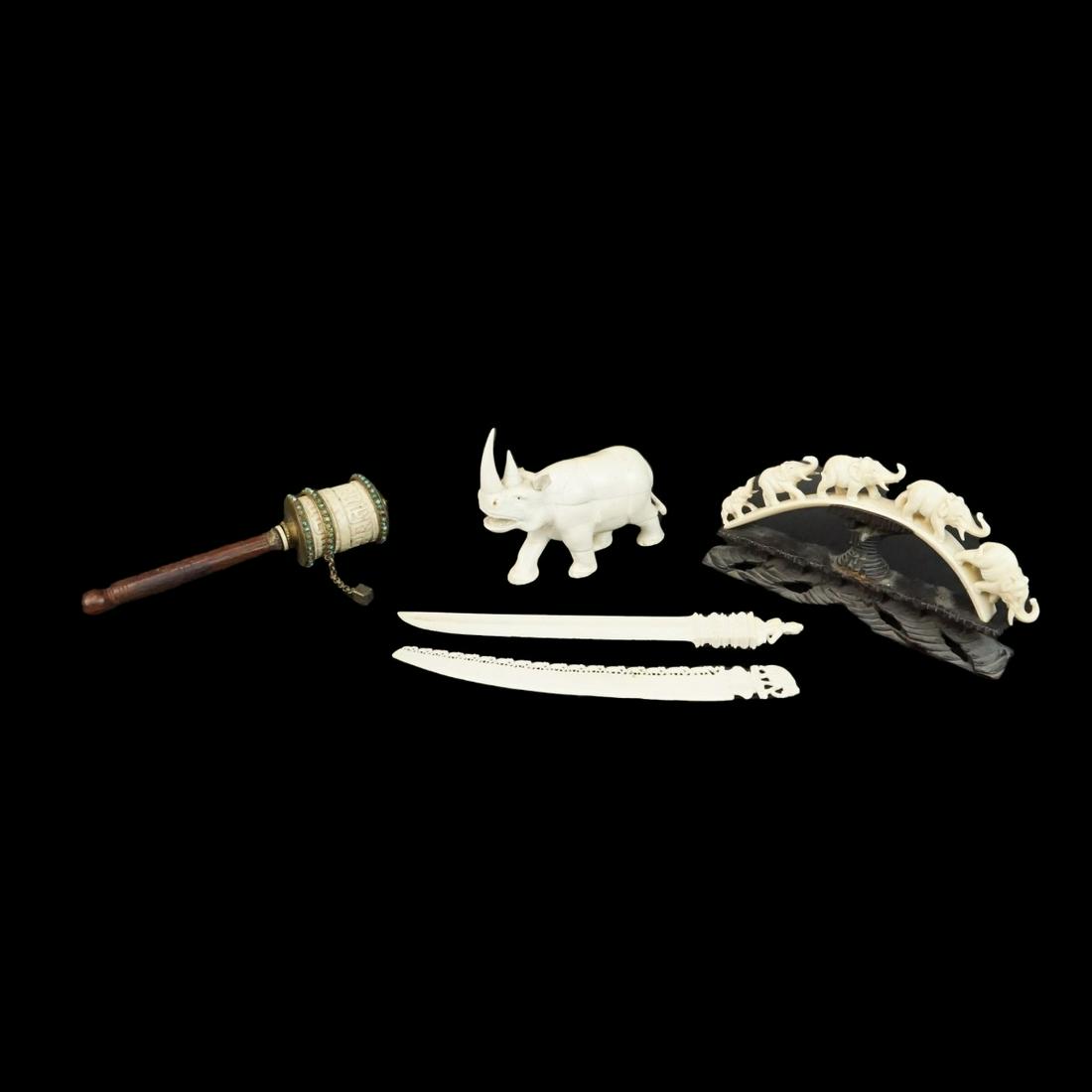 Carved Tableware: Antique African Carved Elephant Bridge Presented on a Wooden Stand, Antique African Carved Rhino Figurine, Vintage Tibetan Carved Prayer Wheel with Inset Turquoise and Coral Stones, Vintage Thai Carve