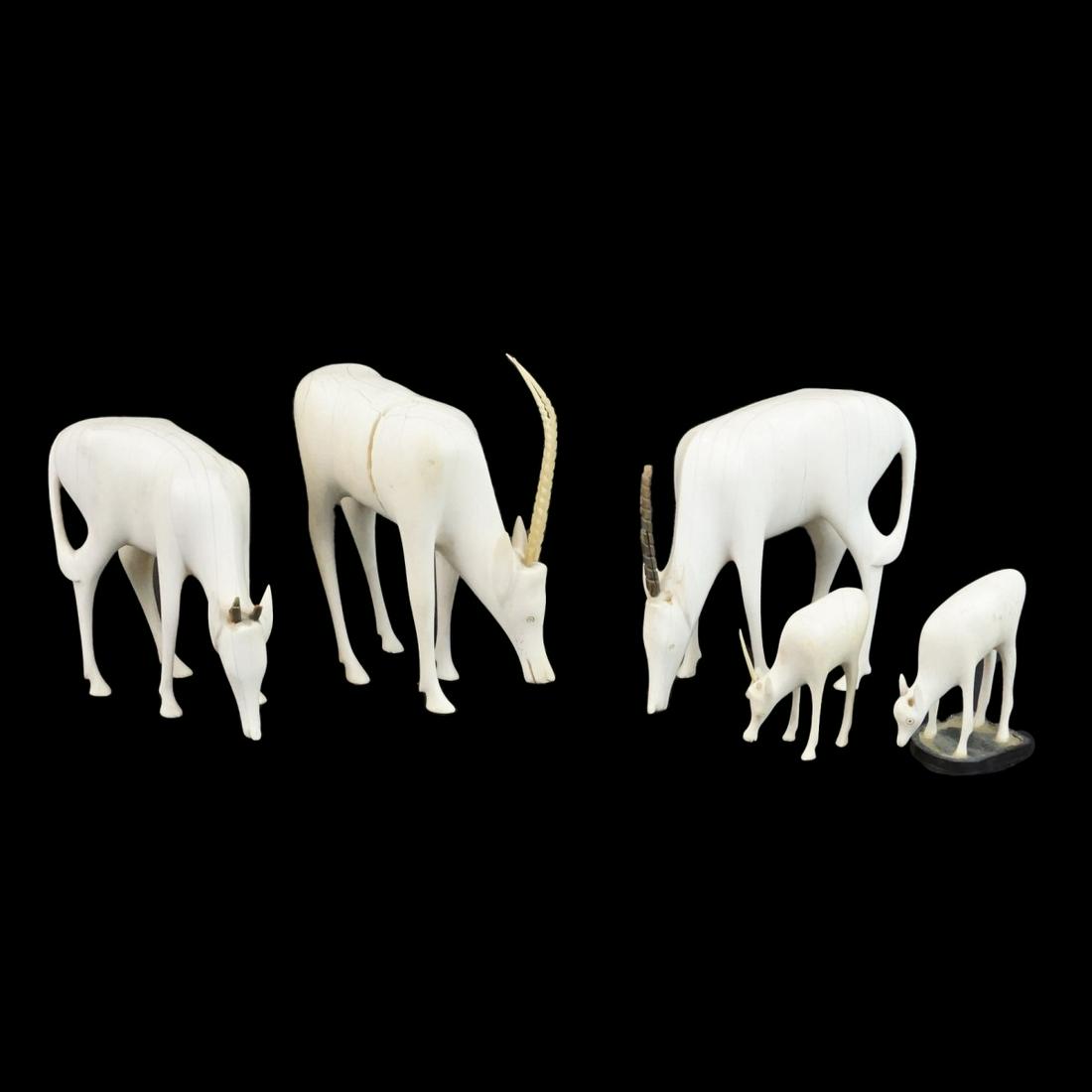 African Figurines: Grouping of Five African Carved Figurines Modeled After Gazelles. Tallest measures 6" x 5-1/2" x 2-1/2". Smallest measures 3" x 2-1/4" x 1-1/8". We Will Not Ship This Item Out of State of Florida. Any