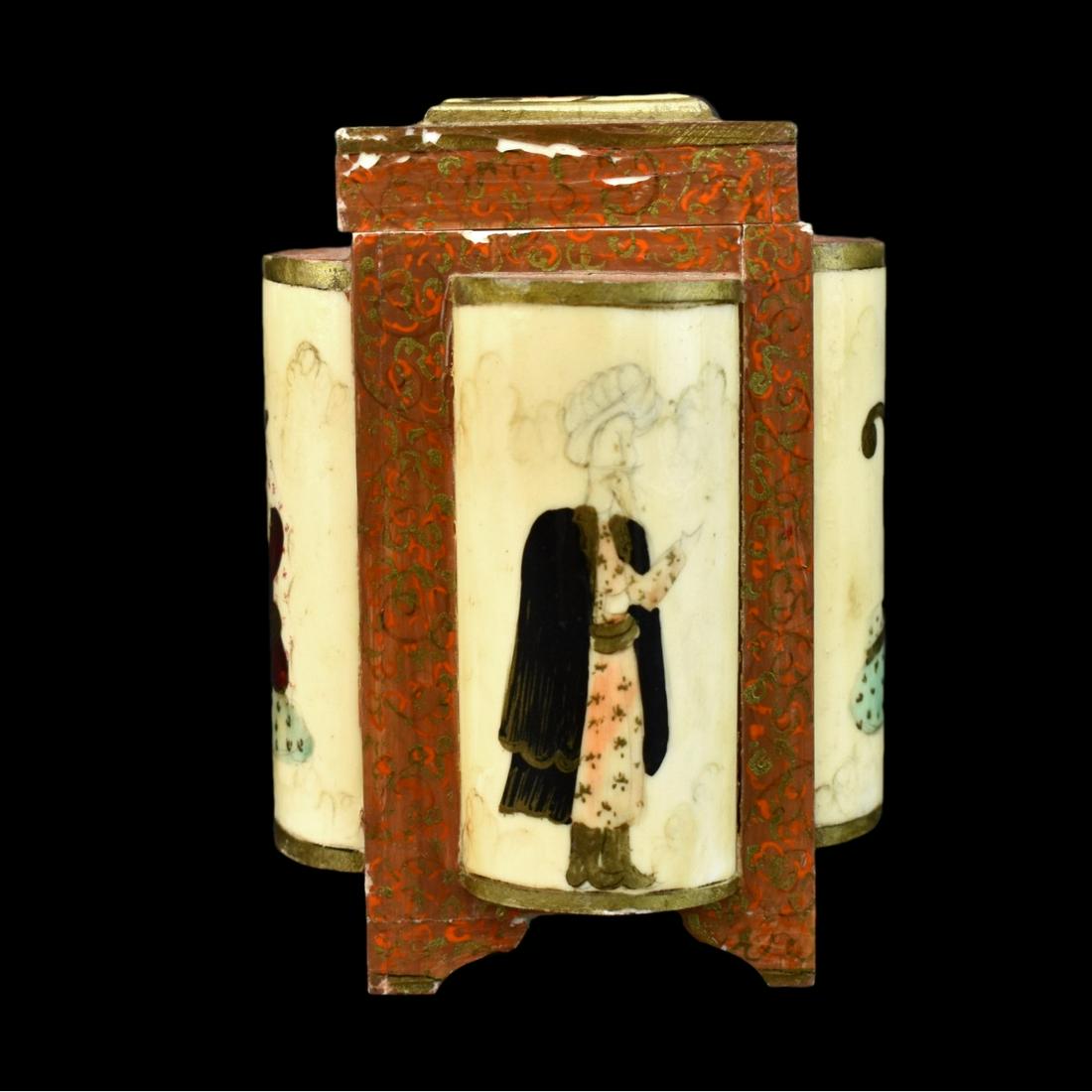 Middle Eastern Bone Box: Antique Middle Eastern Hand Painted Bone Box. Gilt scroll patterns with several portraits on the surface. Measures 4-3/4" H x 3-1/2" W. Condition: Rubbing to paint, normal splits to surface Estimate: