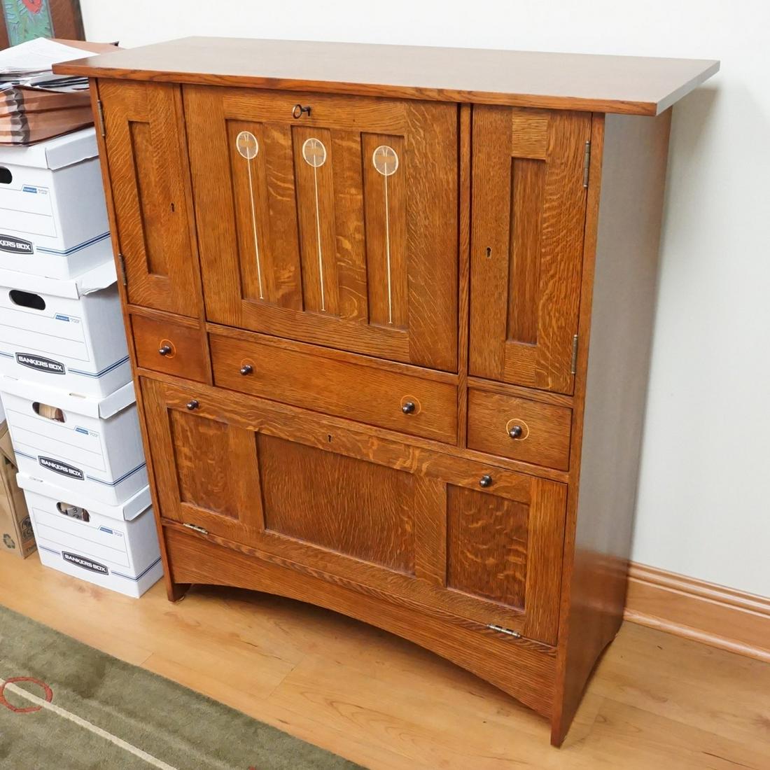 Stickley Fall Front Bar: Stickley (Harvey Ellis Collection) Arts and Craft Oak Fall Front Bar with Inlaid Design. Bar space features a mirror, lined backing, adjustable shelf. Three center guided drawers, fall front door that