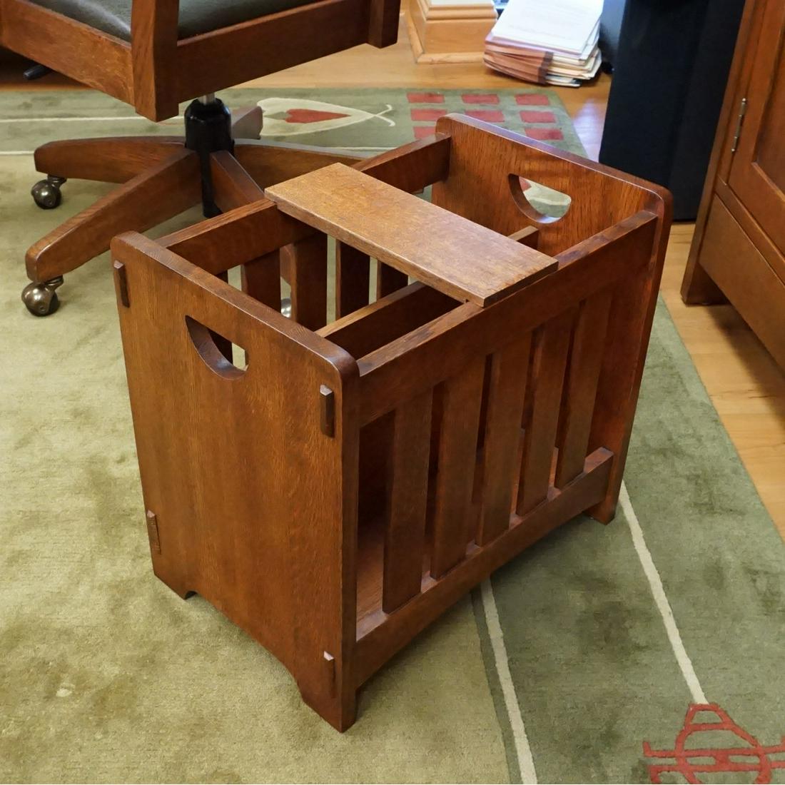 Stickley Magazine Rack: Stickley (Mission Collection) Art & Craft Onondaga Oak Magazine Rack. Stamped markers mark, serial number and decal on the bottom side. Top closing arm to accompany the lot. Measures 17" x 18" x 12". 