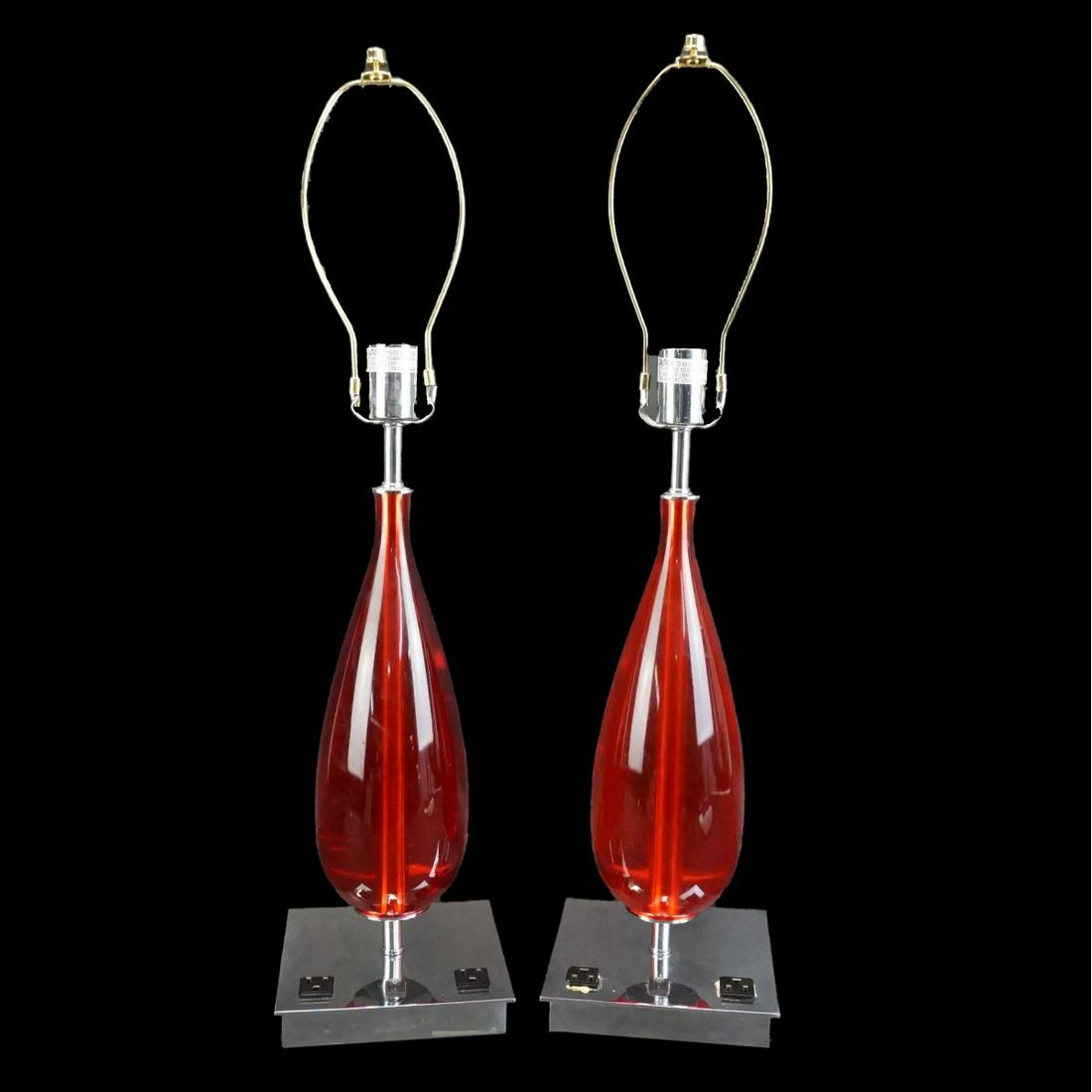 Pair of Lucite Lamps: Pair of Mid Century Red Lucite and Chrome Tear Drop Style Lamps. Overall measures 29-1/2" x 7" x 7". Estimate: $100.00 - $300.00 Domestic Shipping: Third party