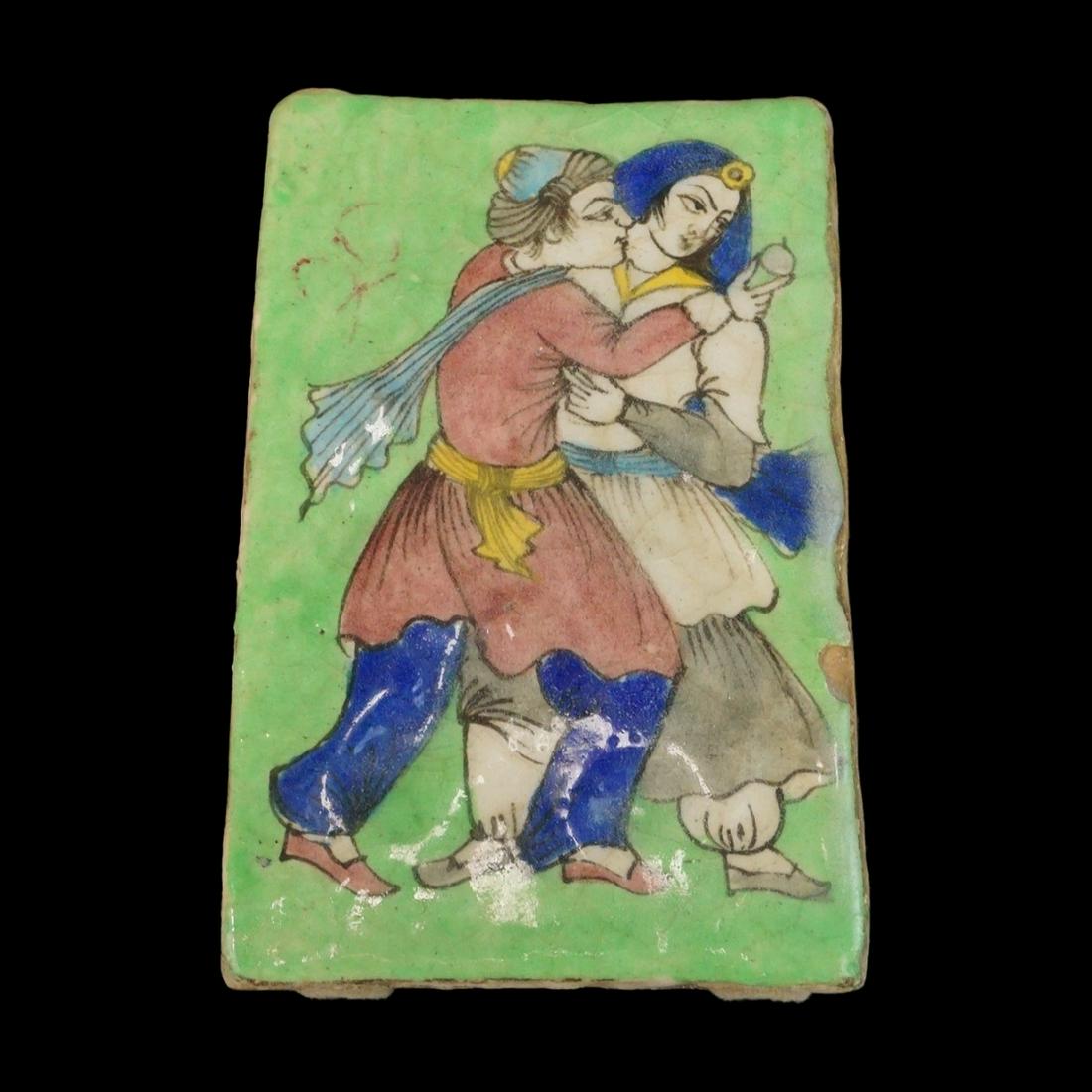 Persian Tile: Vintage Persian Glazed Terracotta Tile. Courting scene motif. Measures 8-1/4" x 5-3/8". Condition: Crazing otherwise good condition. Estimate: $50.00 - $150.00 Domestic Shipping: $66.00