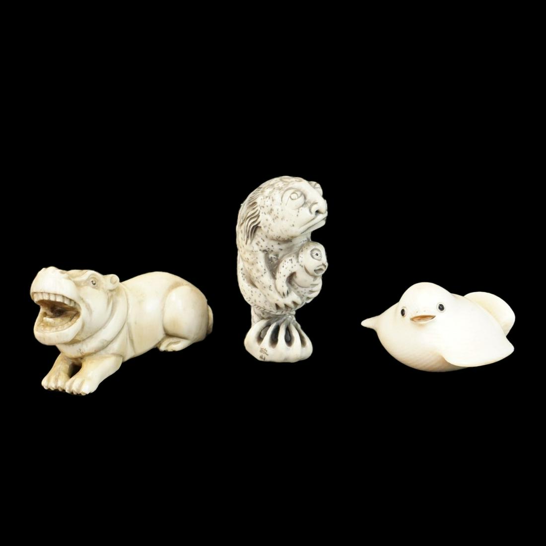 Japanese Netsukes: Antique Japanese Carved Young Sparrow Netsuke, Antique Japanese Carved Hippo Netsuke, and a Antique Japanese Polychrome Carved Fish Figural Netsuke. Each is signed. Tallest measures 2-1/8". Smallest m