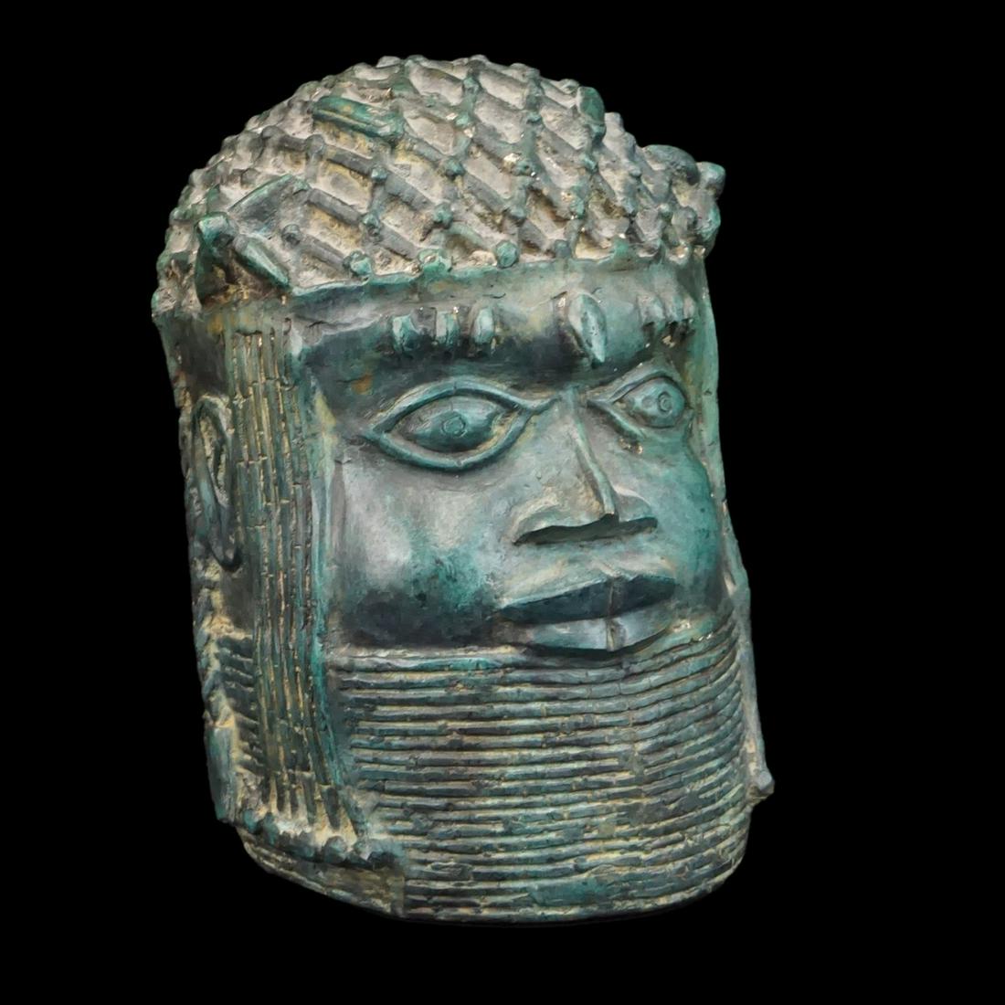 African Benin Head: African Benin Metal Head of an Oba. Measures 10-1/8" x 7-1/2" x 7-1/2". Condition: Spotting otherwise good condition. Estimate: $50.00 - $100.00 Domestic Shipping: $88.00