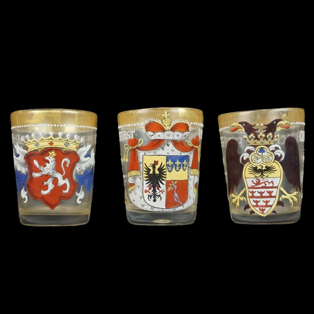 Three Shot Glasses: Set of Three Antique German Hand Painted Coat of Arms Shot Glasses. Measures 3" x 2-3/8". Condition: Good condition. Estimate: $50.00 - $100.00 Domestic Shipping: $48.00