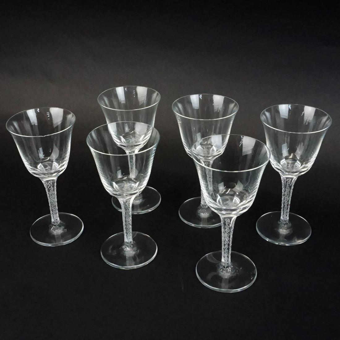 Lalique Wine Glasses: Set of Six Lalique "Treves Clear" Crystal Wine Glasses. Signed. Measures 5-3/4" x 2-7/8" diameter top. Condition: One has a small chip to the rim otherwise good condition. Estimate: $200.00 - $400.00 