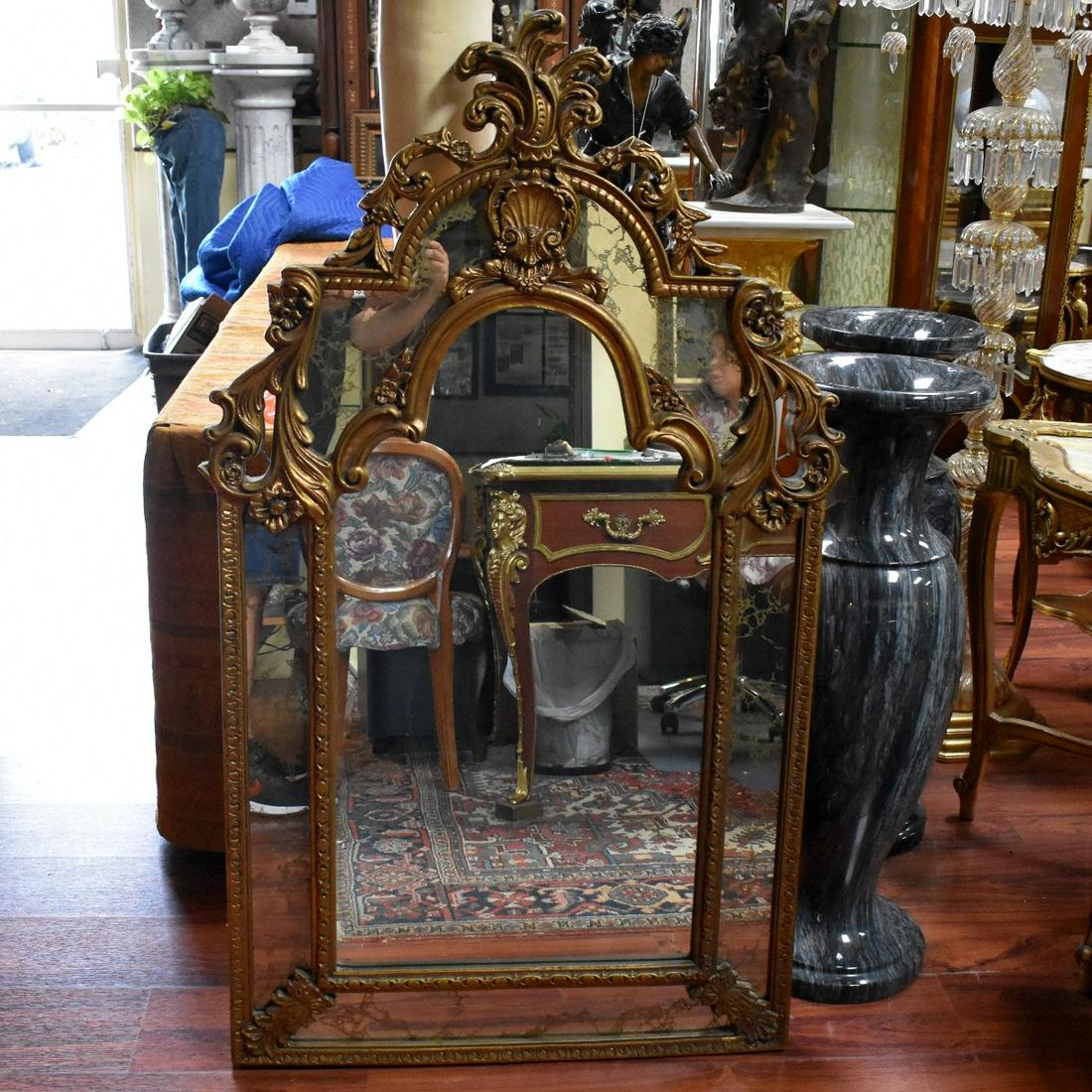 Neoclassical Style Mirror: Vintage Neoclassical Style Gilt Wood Mirror. Measures 54" x 32-1/4". Condition: Rubbing to the gilt otherwise good condition. Estimate: $50.00 - $100.00 Domestic Shipping: Third party