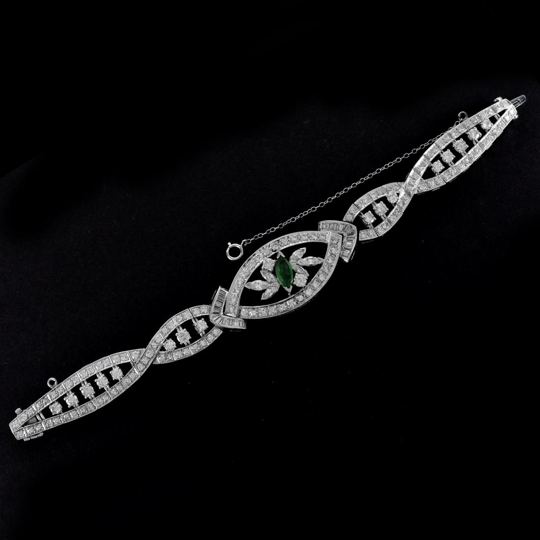 Diamond, Emerald and Platinum Bracelet: Retro Approx. 10.0 Carat TW Round Brilliant, Marquise and Baguette Cut Diamond, 1.0 Carat Marquise Cut Emerald and Platinum Bracelet. Diamonds F-G color, VS1-VS2 clarity. Emerald with vivid color. Sta