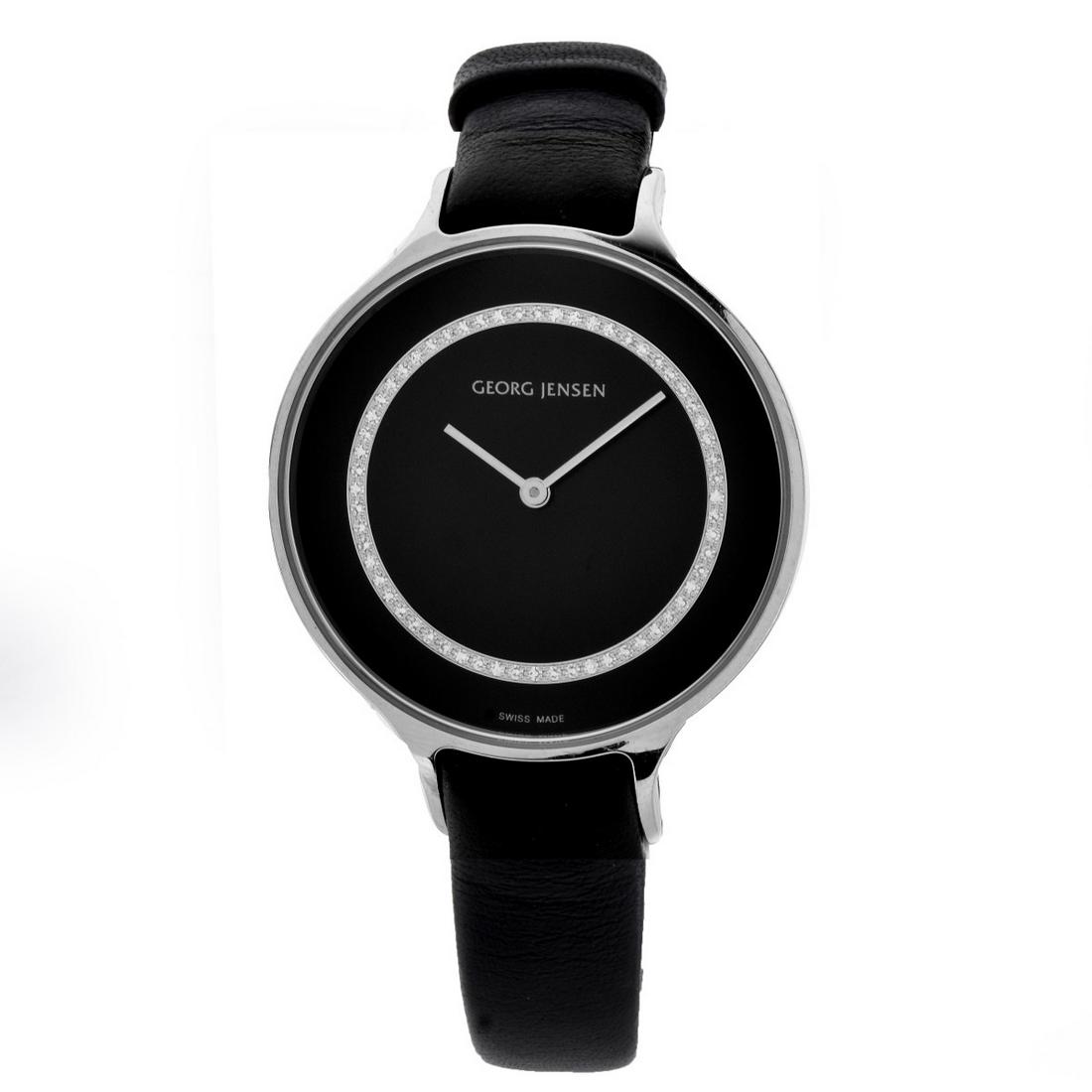 Georg Jensen Watch: Vintage Georg Jensen Swiss Made Stainless Steel Watch with Diamond Accented Black Dial, Leather Strap. Quartz movement. Case measures 38mm. Strap measures 9" L. No box or papers. Condition: Good vinta
