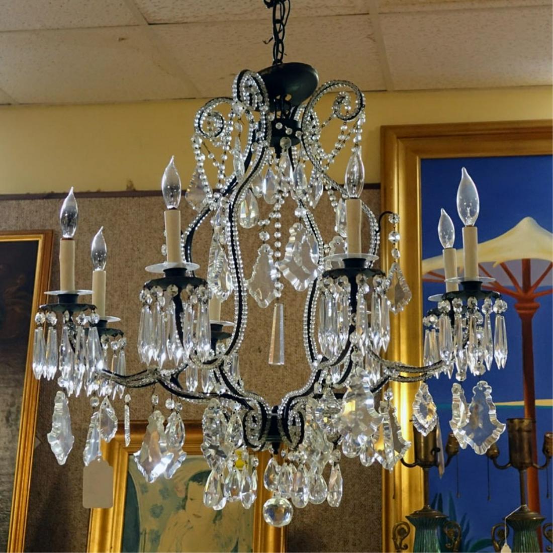 Antique Style Beaded Chandelier: Antique Style Beaded Chandelier with Hanging Prisms. Measures 26" H x 30" W. Condition: Rubbing to frame, a few missing crystals otherwise good condition. Estimate: $300.00 - $500.00 Domestic Shipping
