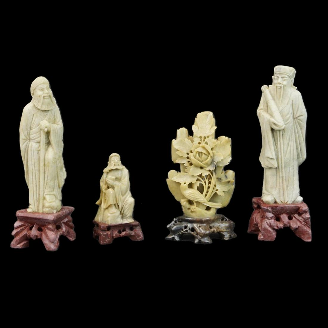 Chinese Figurines: Lot of Four Vintage Chinese Carved Figurines. Includes three wise men along with a flower group. Tallest measures 8-1/8" x 3". Smallest measures 4-1/8" x 2-1/2". Condition: One figure is not glued on 