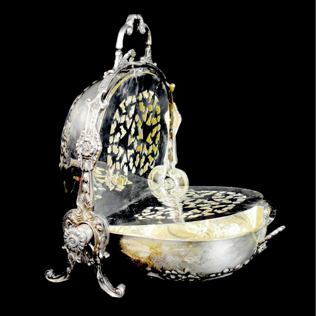 Antique Victorian Mufineer: Antique Victorian Silverplate Mufineer. Unmarked. Measures 10" x 9" x 4-1/4". Condition: One interior panel is separated from the fitting otherwise good condition. Estimate: $50.00 - $100.00 Domestic 