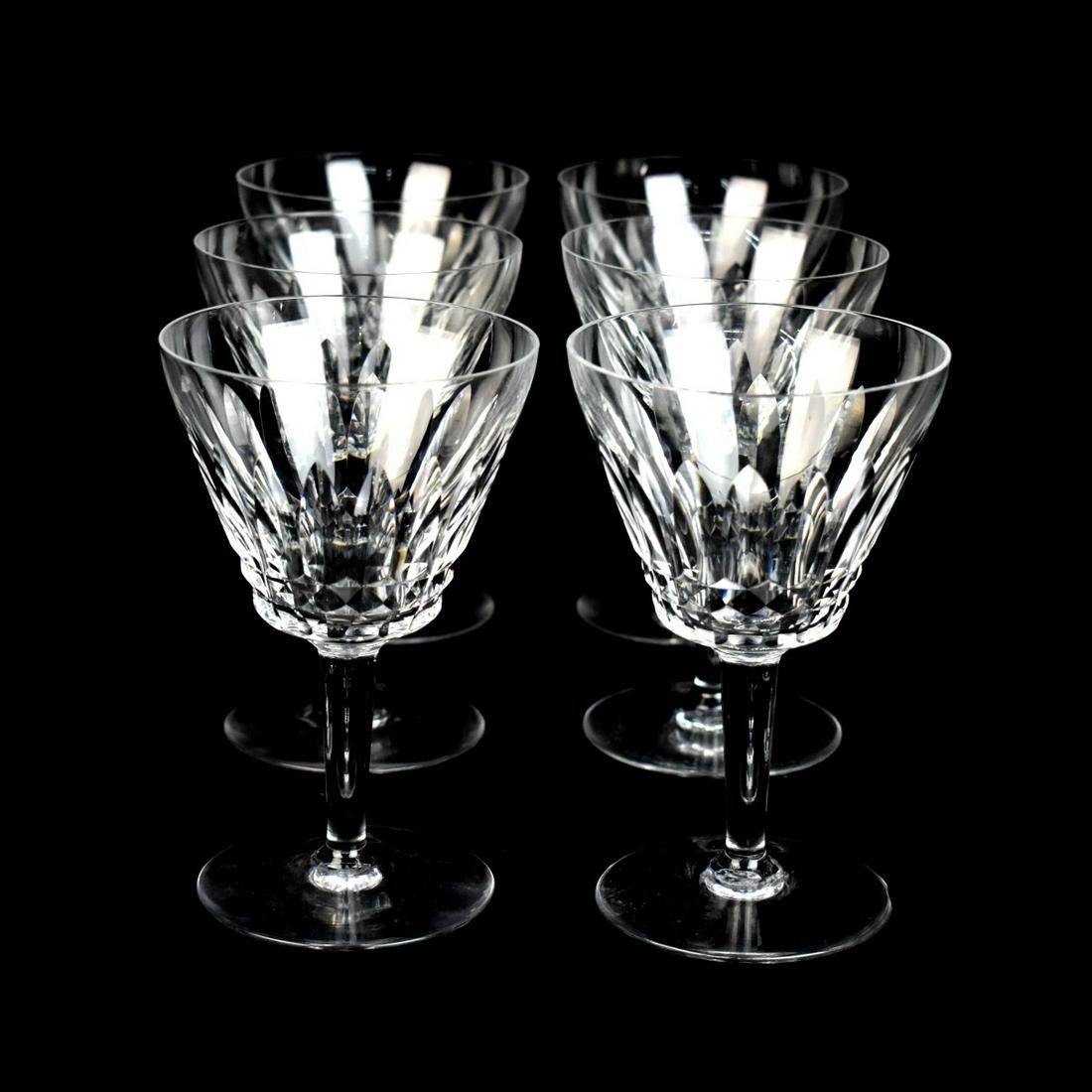 Baccarat Tall Water Goblets: Set of Six Baccarat "Lorraine" Crystal Tall Water Goblets. Signed. Measures 6-1/8" x 3-7/8". Condition: One goblet has a small chip to the rim otherwise good condition. Estimate: $100.00 - $300.00 Dom