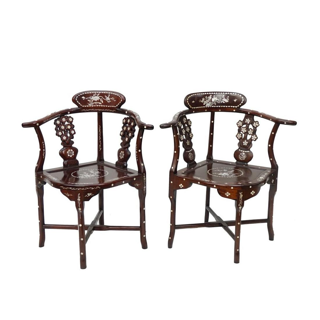 Chinese Corner Chairs: Pair of Mid Century Chinese Rosewood Corner Chairs. Inset with mother of Pearl. Measures 32-1/2" x 26-1/2'. Condition: Normal surface scuffs otherwise good condition. Estimate: $100.00 - $200.00 Domes