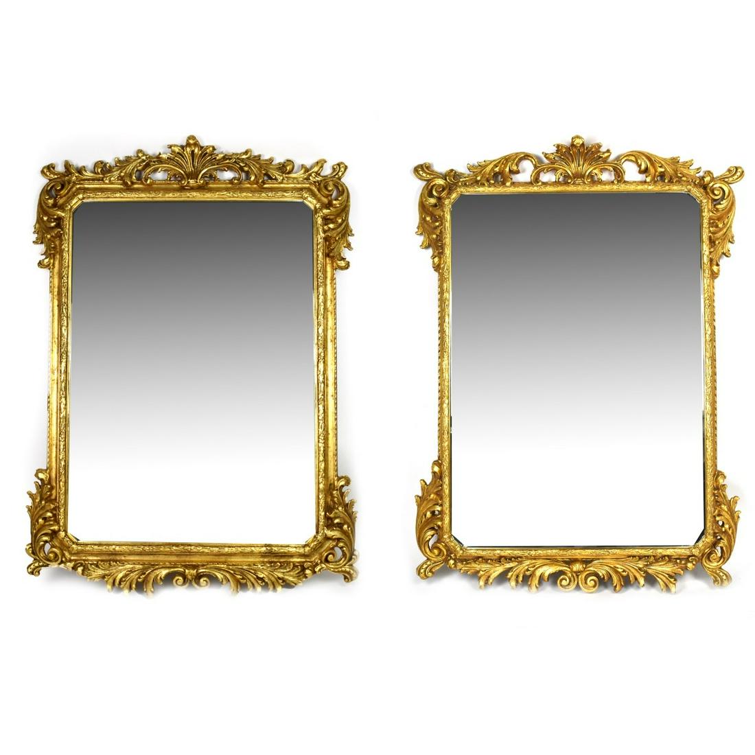 Pair of Louis XVI Style Mirrors: Pair of Louis XVI Style Gilt Carved Beveled Glass Mirrors. Foliage detail sprawled on the frame. Sight measures 41-1/2" x 29-1/4". Frame measures 55" x 32-1/2". Condition: Rubbing to the frame otherwi