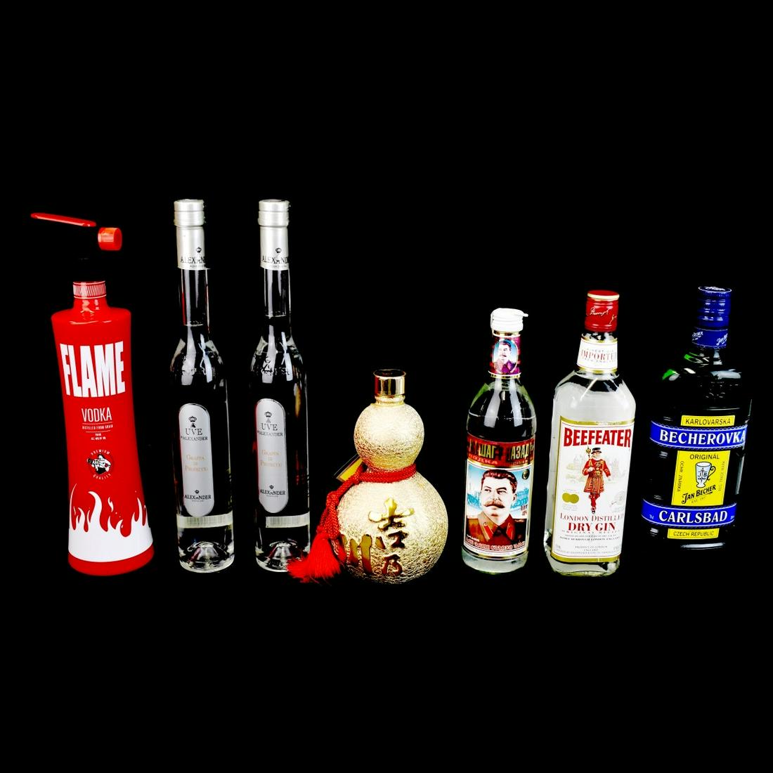 Seven Assorted Bottles: Grouping of Seven Assorted Bottles to Include Two UVE D'Alexander Grappa Di Prosecco, Beefeater Dry Gin, Becherovka Carlsbad Liquer, Russian Vodka with Stalin Insignia, Flame Vodka, and Yoshi No Gawa 