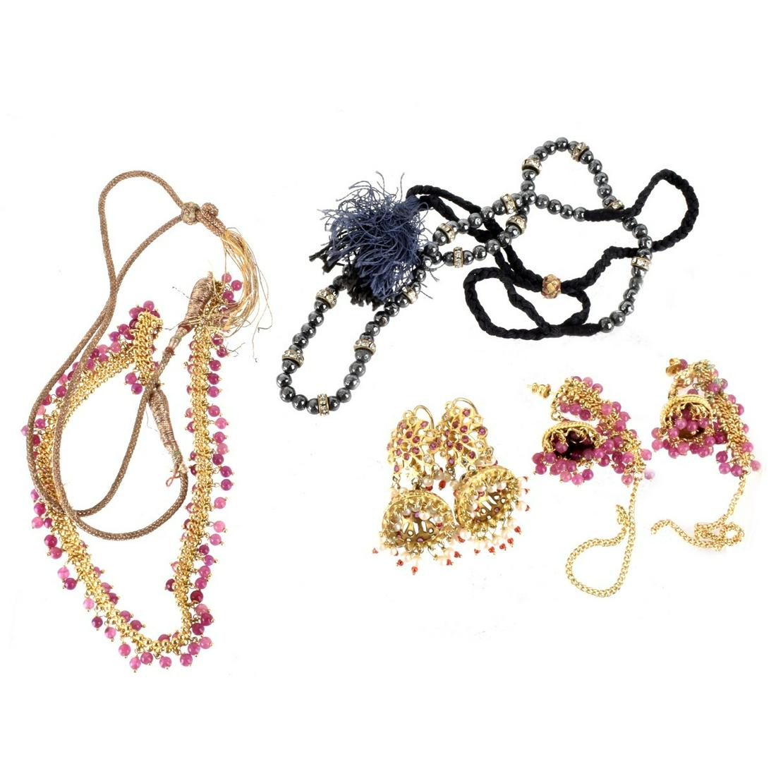 Fashion Jewelry: Collection of fashion Jewelry. To include gold tone metal necklace and earrings set with pink beads; gold tone earrings set with pearls, pink stones and glass and a hematite bead necklace with glass.