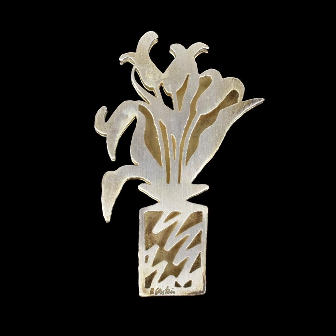 David Gerstein Silver Pendant / Brooch: Vintage David Gerstein Sterling Silver Flower Bouquet Pendant / Brooch. Signed, stamped 925. Measures 2-3/4" H, 1-3/4" W. With fitted box. Estimate: $50.00 - $100.00 Domestic Shipping: $40.00 Conditio