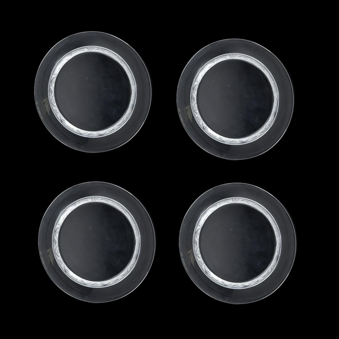 Four Lalique "Phalsbourg" Crystal Plates: Set of Four Lalique "Phalsbourg" Clear and Frosted Crystal Plates. Signed Lalique France. Measures 8-5/8". Estimate: $100.00 - $300.00 Domestic Shipping: $66.00 Condition: Good condition.