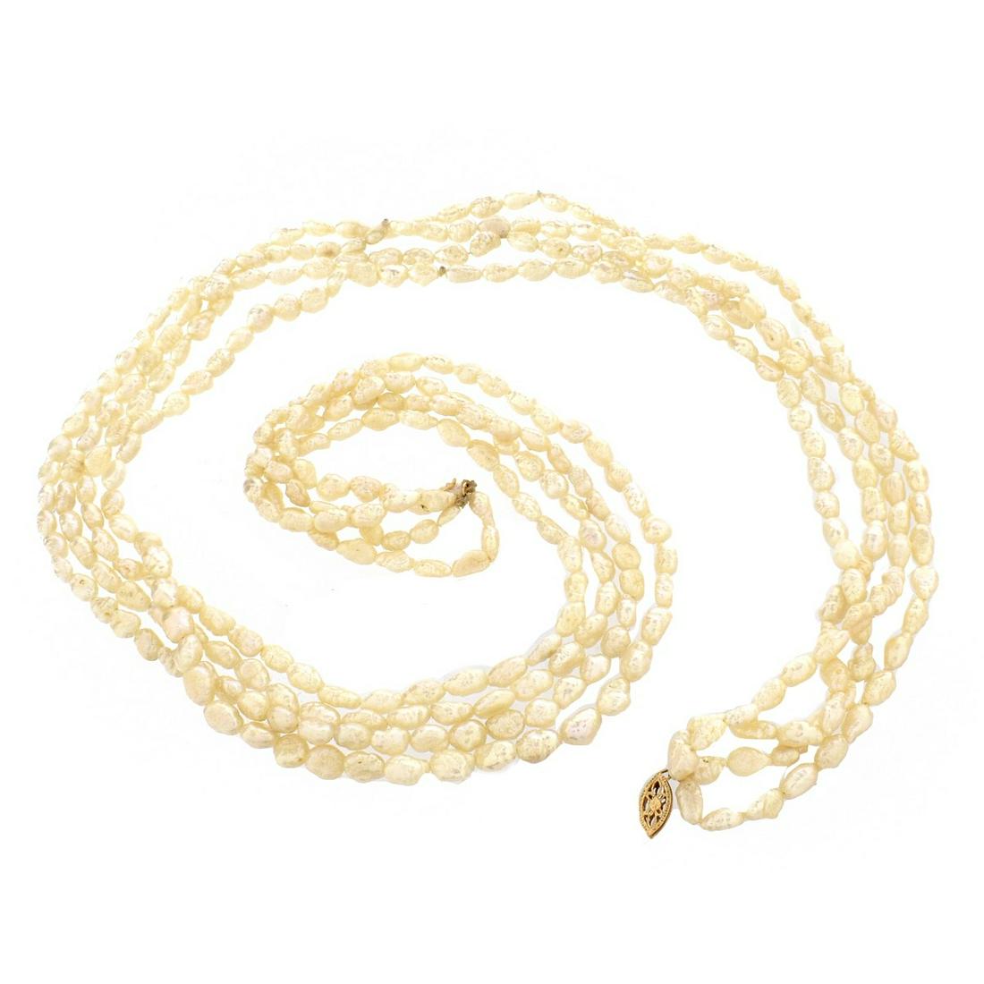 Pearl and 14K Necklace: Vintage Four Strand Baroque Pearl Necklace with 14 Karat Yellow Gold Clasp. Pearls measure approx. 3.0-5.0mm. Clasp stamped 14K. Necklace measures 23-1/2" L. Approx. weight: 39.2 dwt. Estimate: $50.00
