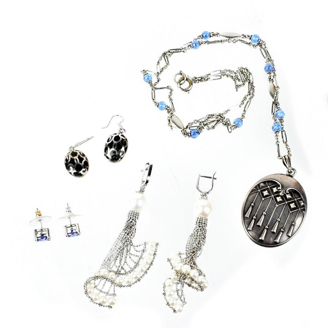 Silver Jewelry: Vintage Silver Jewelry. To include silver pendant locket necklace with blue glass beads, silver and pearl chandelier earrings, silver and black onyx pendant earrings and silver and blue stone (possibl