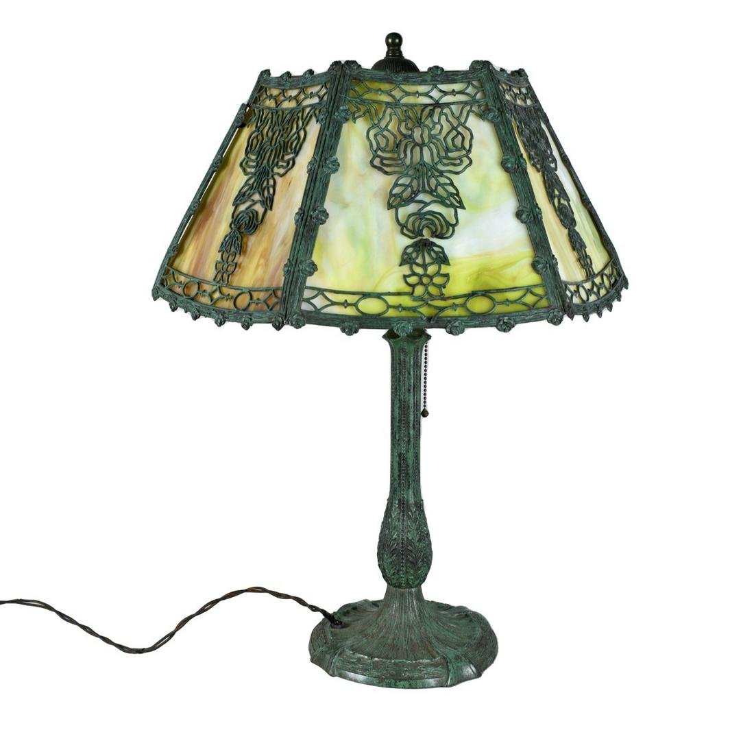 Antique Slag Glass Lamp: Antique Slag Glass Lamp Presented on a Bronzed Metal Base. Overall height 25-3/4", shade measures 17-1/4" diameter. Estimate: $300.00 - $500.00 Domestic Shipping: Third party Condition: Some losses to