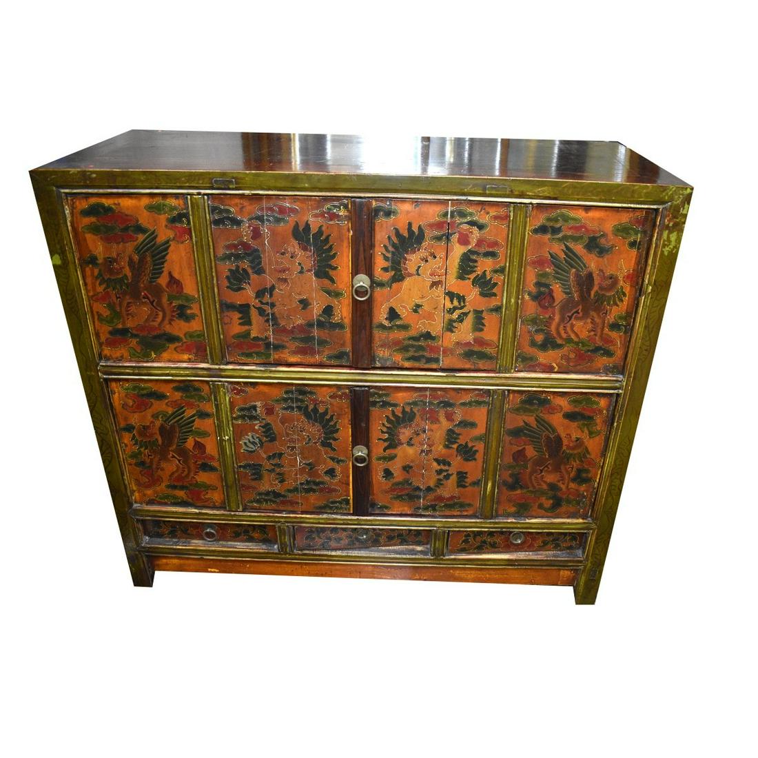 Tibetan Paneled Cabinet: Tibetan Polychromed Wood Paneled Cabinet. Measures 38" x 42-5/8" x 17-3/4". Estimate: $200.00 - $300.00 Domestic Shipping: Third party Condition: Some scratches to the top and has some surface scuffs.