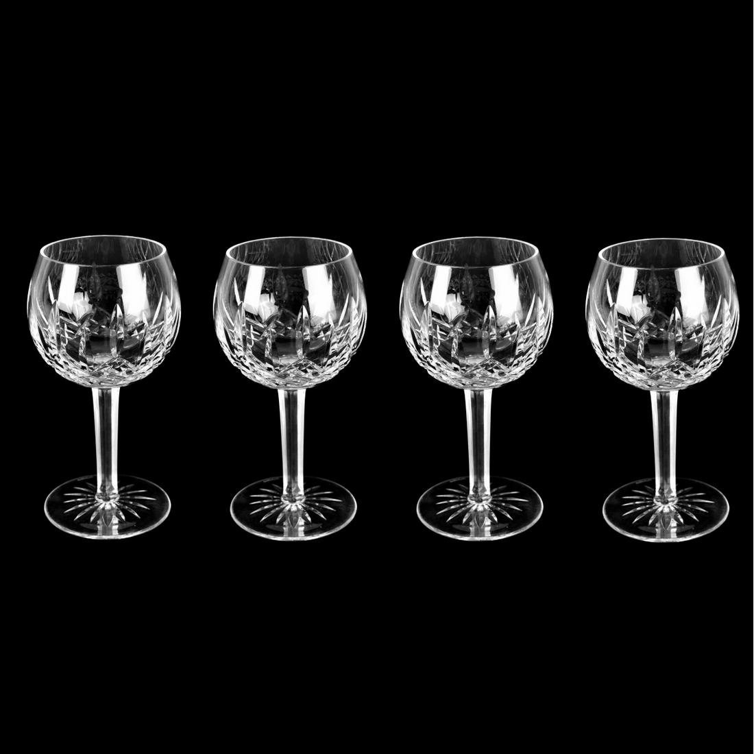 Waterford "Lismore" Balloon Wine Glasses: Set of Four Waterford "Lismore" Cut Crystal Balloon Wine Glasses. Signed. Measures 7-3/4" H, 3-1/4" diameter rim. Estimate: $100.00 - $300.00 Domestic Shipping: $88.00 Condition: Good condition.