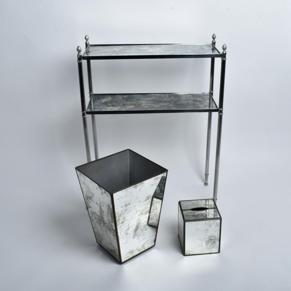 Three Modern Mirrored Toilet Accessories: Lot of Three Modern Mirrored Toilet Accessories to Include a Waste Basket, Napkin Cover, along with a Display Shelf. Waste basket measures 12-5/8" x 9" x 9". Display shelf measures 27" x 20-1/2" x 9-1