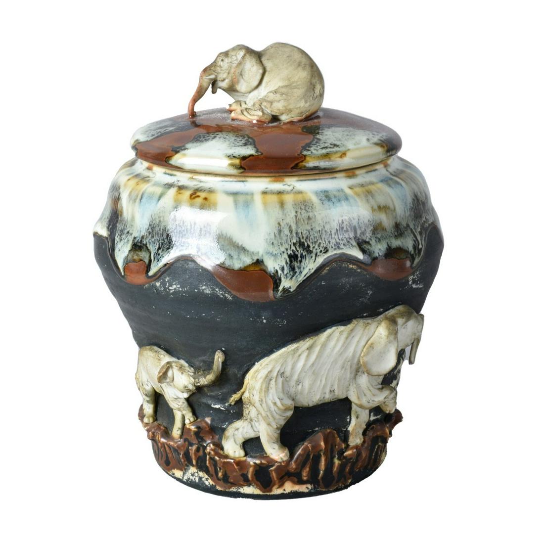 Antique Japanese Sumida Gawa Covered Jar: Antique Japanese Sumida Gawa Glazed Pottery Covered Jar with Raised Elephant Relief. Signed. Measures 7-3/4" x 5-3/4". Estimate: $200.00 - $400.00 Domestic Shipping: $72.00 Condition: Good condition.