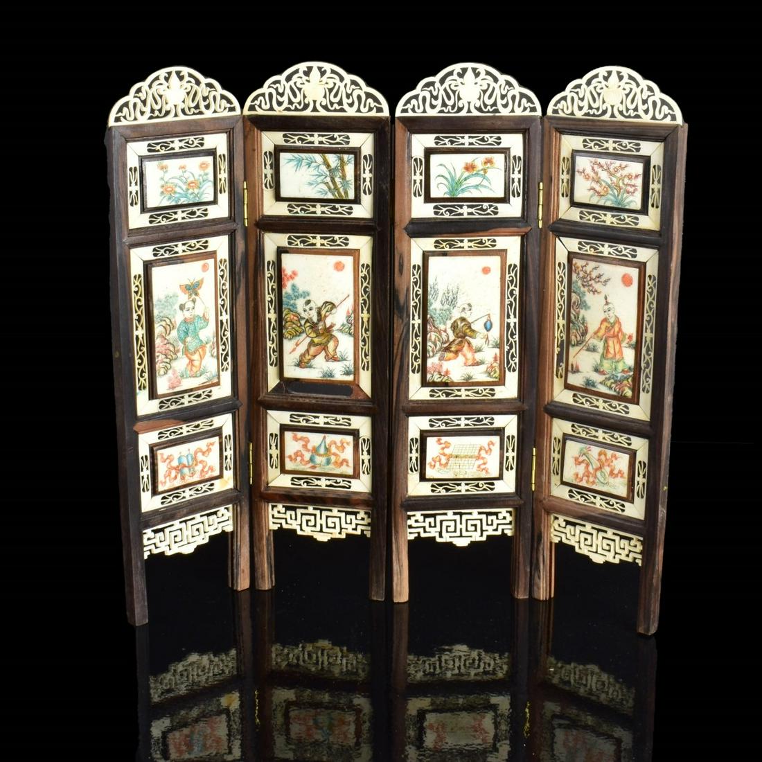 Antique Chinese Carved Bone Table Screen: Antique Chinese Carved Polychrome Bone Table Screen. Measures 11-5/8" x 12-1/4". Estimate: $300.00 - $500.00 Domestic Shipping: $72.00 Condition: Two of the smaller panels have hairline cracks otherwi