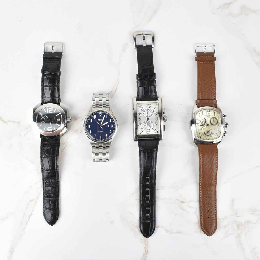 Men's Assorted Watches: Grouping of Four Men's Assorted Watches. Includes a Invicta 100 meters with leather bracelet, Fossil Est. 1984 with blue dial stainless steel bracelet, Ritmo Mundo with grey dial and leather bracelet,