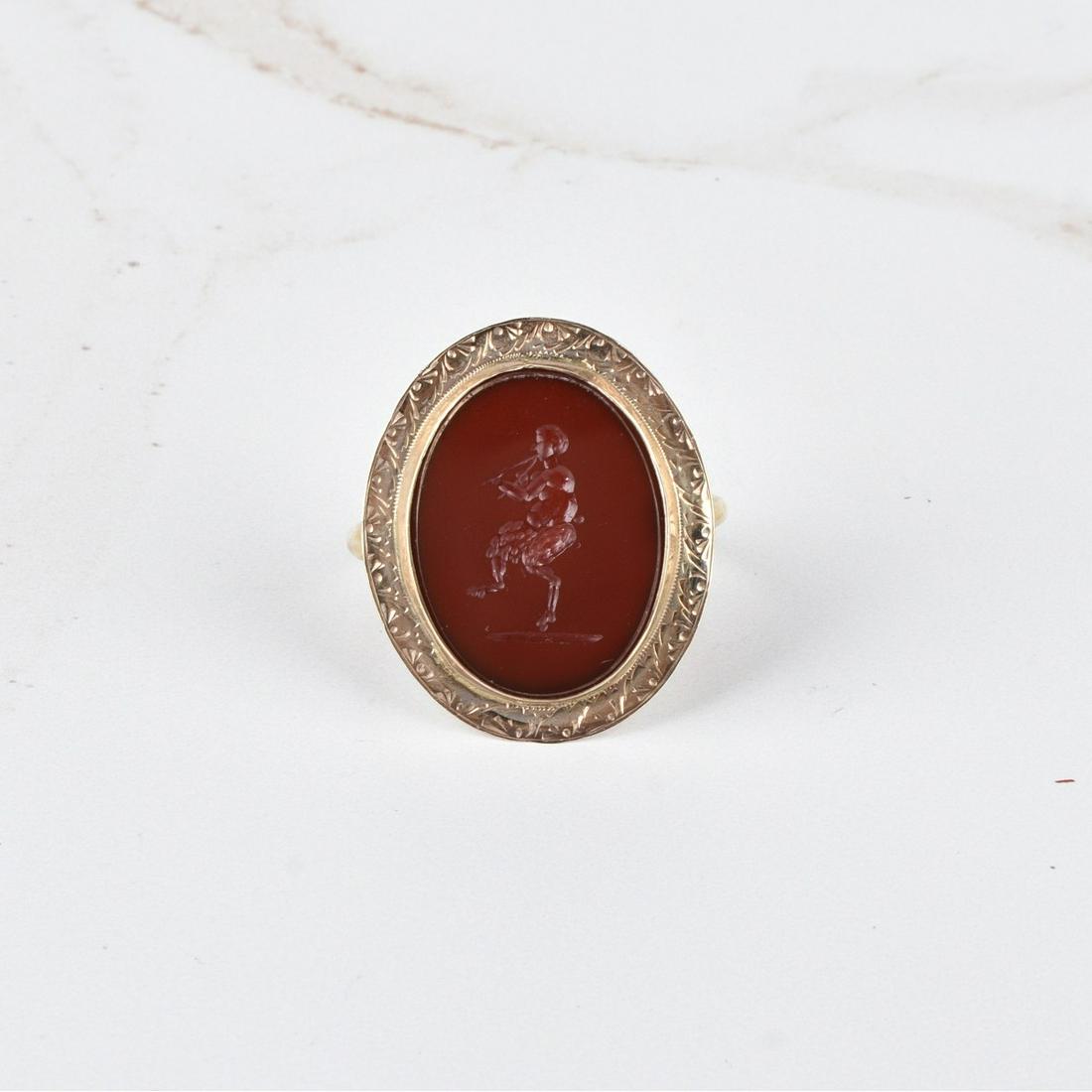 Antique Carnelian and 14K Ring: Antique 19th Century Carved Carnelian Pan Intaglio and 14 Karat Yellow Gold Ring. Ring size 9. Approx. weight: 5.33 grams. Estimate: $250.00 - $350.00 Domestic Shipping: $40.00 Condition: Very good an