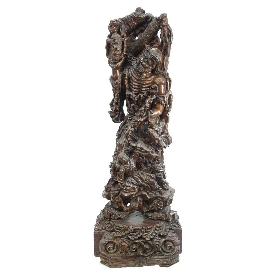 Life Size 19/20C. Chinese Boxwood Li Tieguai: Life Size 19/20th Century Chinese Boxwood Carved Immortal Figure of Li Tieguai. Finely carved, depicted in a standing position, flanked by animals and figures. Measures 55" H x 19-1/2" W x 15" D. Esti