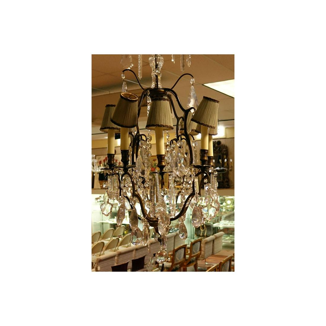 Mid Century Crystal & Brass Eight Light Chandlier: Mid Century Crystal and Brass Eight Light Chandelier with hanging Prism. Measures 34" H x 18" Dia. Estimate: $300.00 - $600.00 Domestic Shipping: Third party Condition: Rubbing to brass, missing hangi