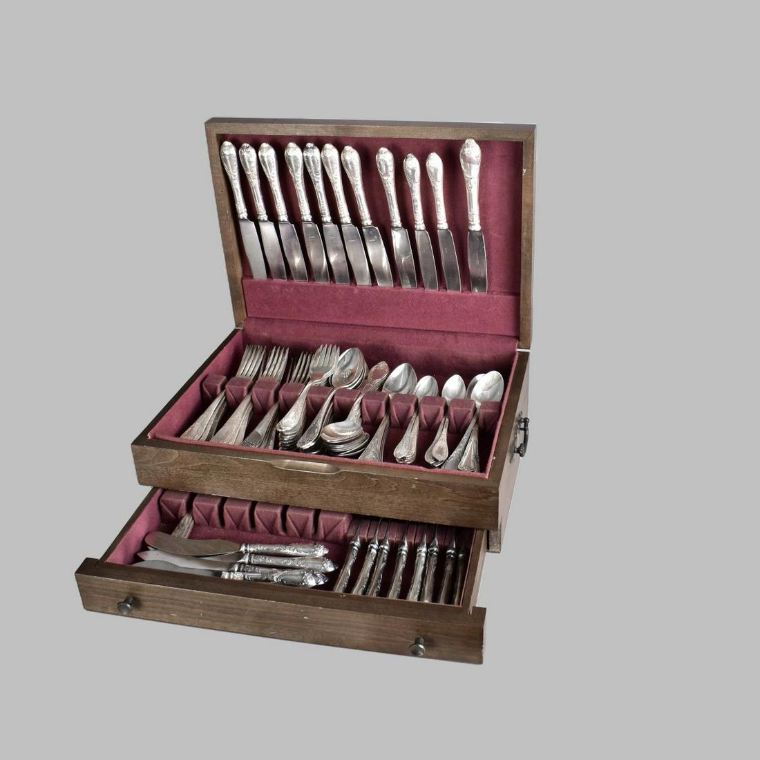 Russian Assembled Silverplate Flatware: Seventy (70) Piece Russian Assembled Silverplate Flatware. Includes: Includes: (11) knives ranging in size from 9-1/2" - 10-1/4", (15) forks measuring 8-1/4", (11) salad forks, (18) spoons measuring 8