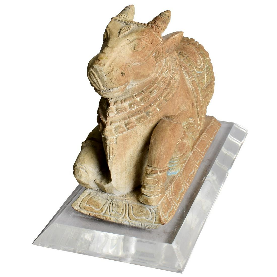 Modern Chinese Carved Sacred Cow: Modern Chinese Carved Wood Sacred Cow Presented on a Lucite Base. Overall measures 7-3/4" x 10-3/4" x 5-1/4". Estimate: $50.00 - $150.00 Domestic Shipping: $66.00 Condition: Good condition.