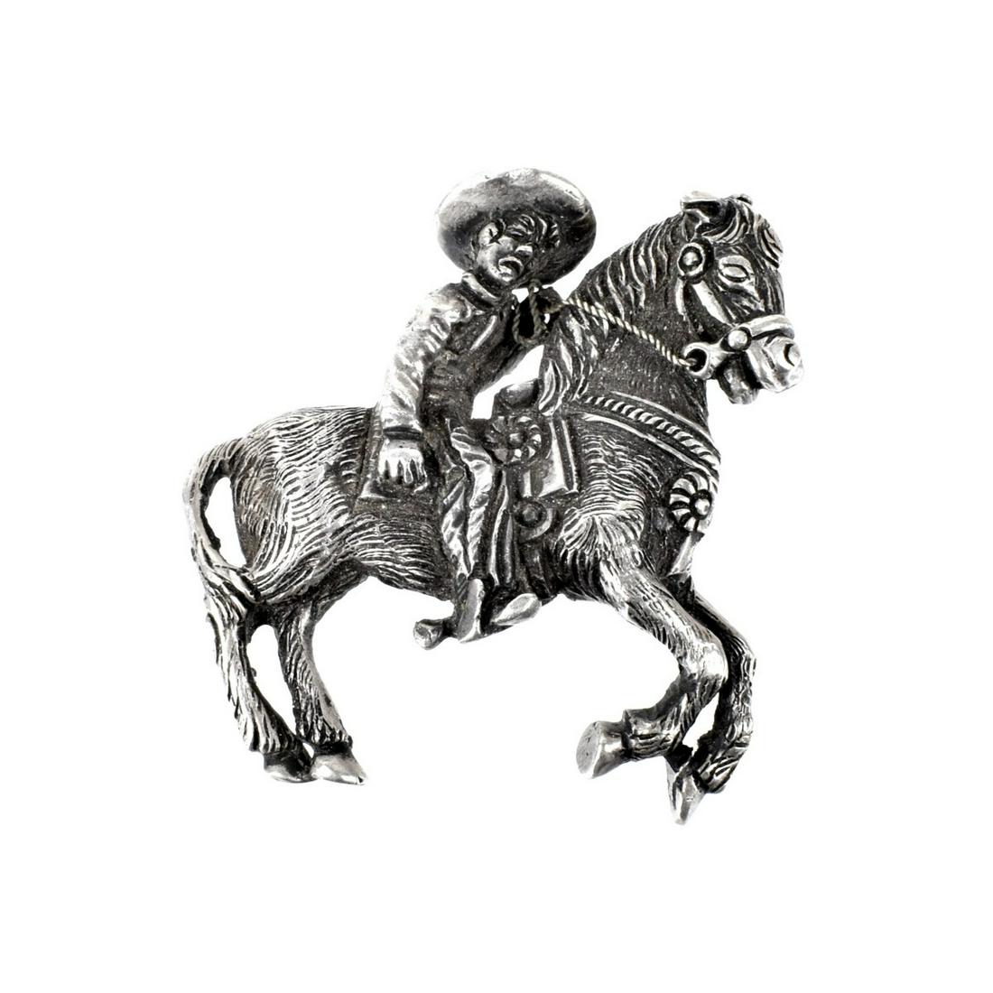 Mexican Silver Horse and Rider: Antique Mexican Handmade Horse and Rider. measures 2-5/8" H, 2-1/2" W. Approx. weight: 91.34 grams. Could be converted to a belt buckle or brooch. Estimate: $50.00 - $150.00 Domestic Shipping: $40.00 